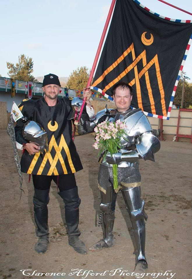 Toby Capwell and his squire, Lonnie Colson, who is wearing a surcoat and holding a banner displaying Toby's heraldic arms (photo by Clarence Alford Photography)