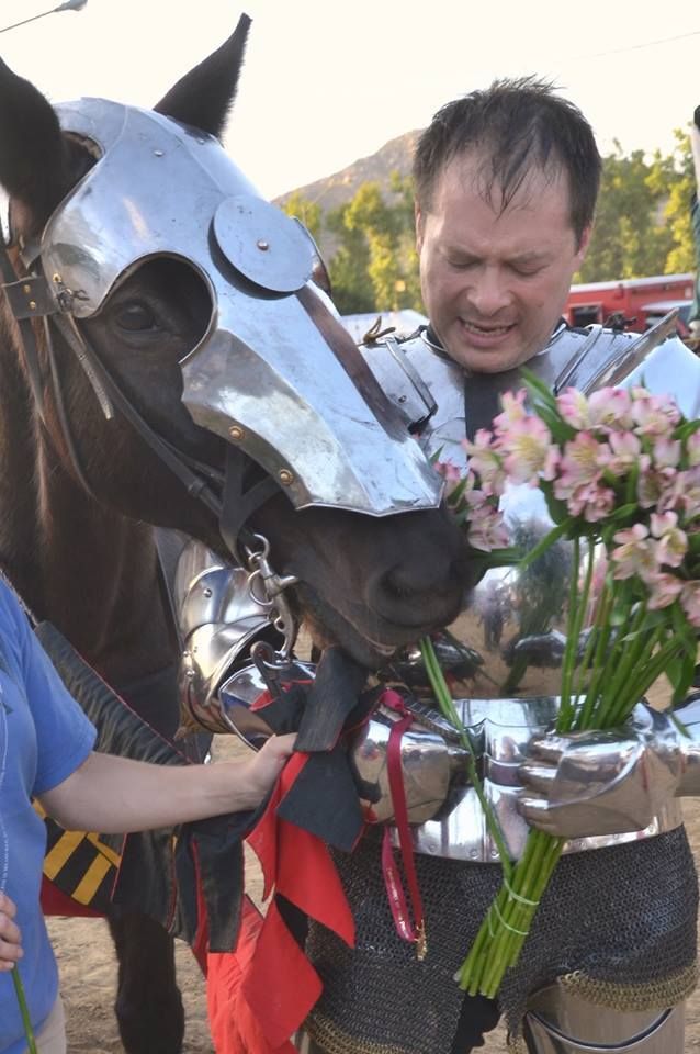 Azteca horse Lucas asserts that he deserves some of the prize flowers  that Toby Capwell is holding (photo by Michael Lozich)
