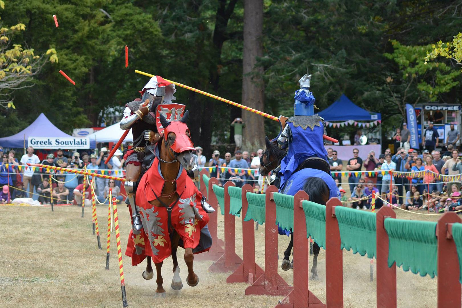 Sarah Hay(left) breaks not just the frangible tip of her lance, but the solid base of the lance all the way down to her hand in a strike against Andrew McKinnon(right) during the jousting competition at Harcourt Park 2015 (photo by Gene Alcock)