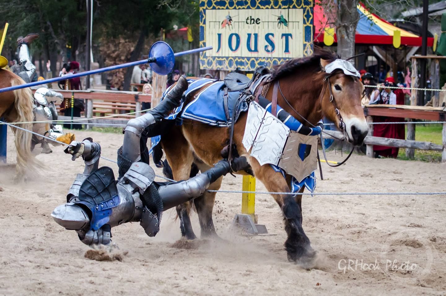 Charlie Andrews(far left) and Mark Desmond(center) unhorse each other during the  Mid-Faire Jousting Tournament at Sherwood Forest Faire 2015(photo by GRHook Photo)