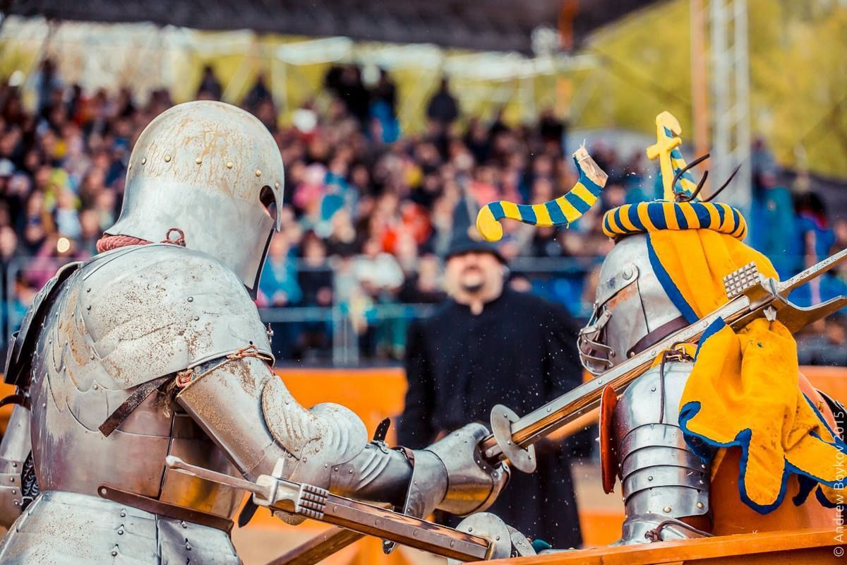 Viktor Ruchkin(left) chops part of the crest off of Sergey Zhuravlev's helm during the poleaxe competition at the Tournament of St George 2015 in Moscow, Russia (photo by Andrew Boykov/Ratobor Show)