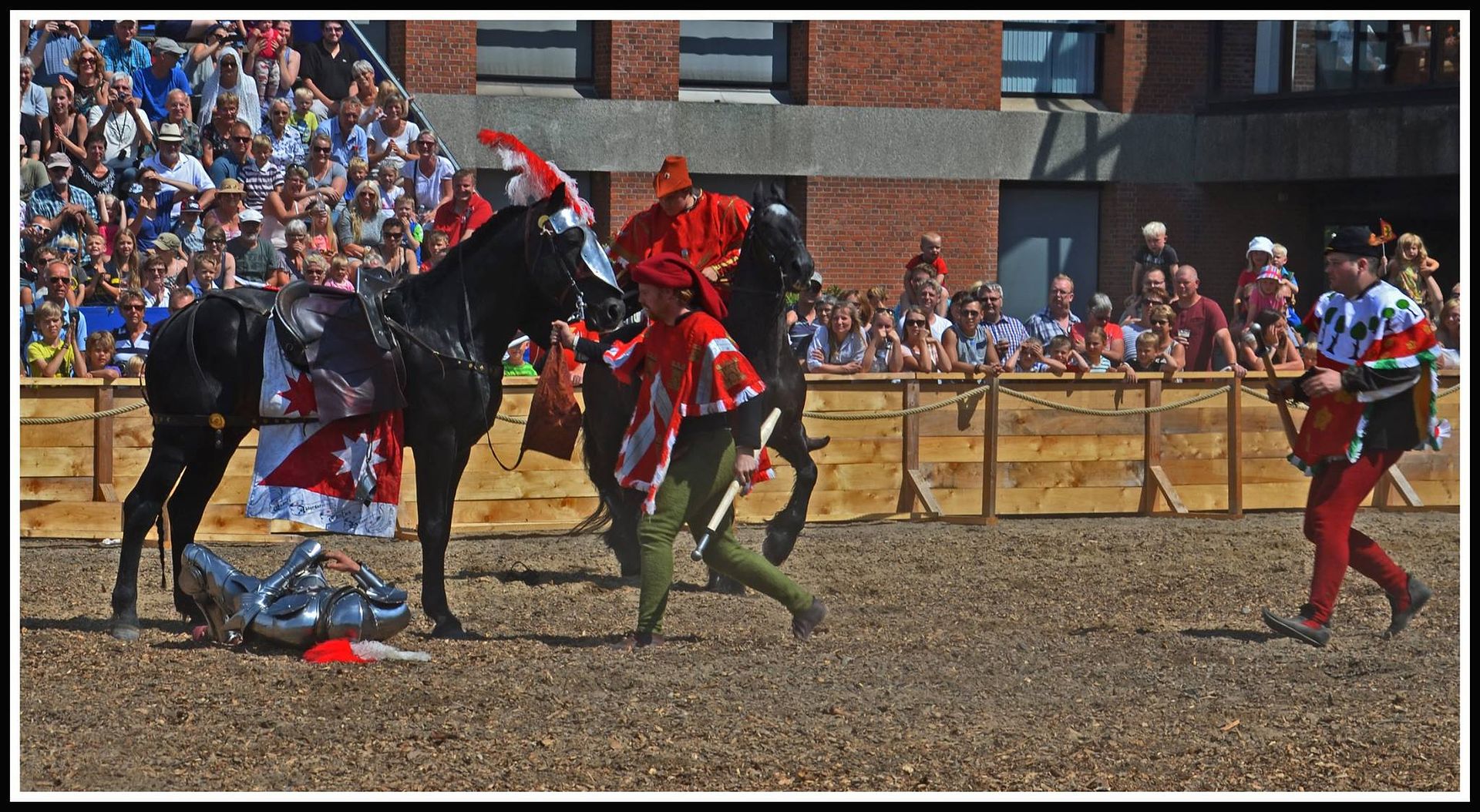 Andreas Wenzel comes off his horse during a mounted melee at the Nyborg Joust 2014 (photo by Hanno van Harten)