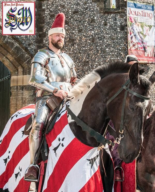 Jan Gradon, in front of Arundel Castle and the banner featuring his image  from the previous year's jousting tournament (photo by Stephen Moss)
