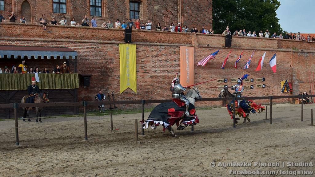 Jan Gradon, acting as Knight Marshal at the Tournament of King John III, keeps a close eye on jousters Steve Mallet and Jeffrey Hedgecock (Photo by Studio A)