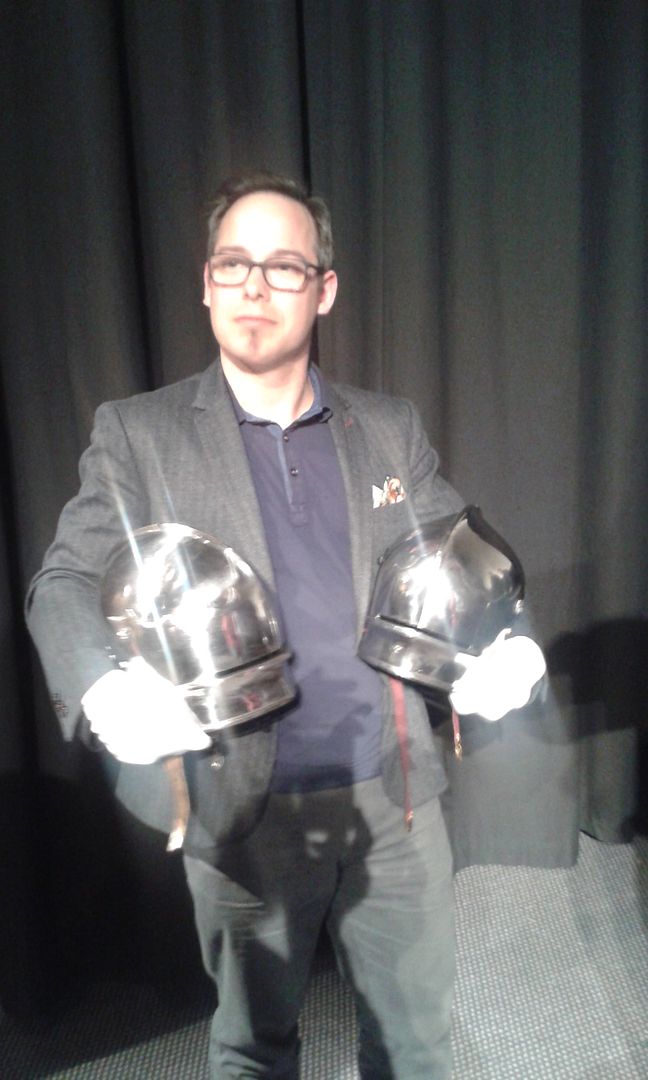 Jouster Ben van Koert holds his helm(his left hand) and the original helm(his right hand)  that it was based on (photo from Judge-Tutor Semple)